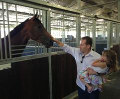 Neil Francis and daughter Sophie at the Rosehill stables, giving their horse Traitor some attention...
